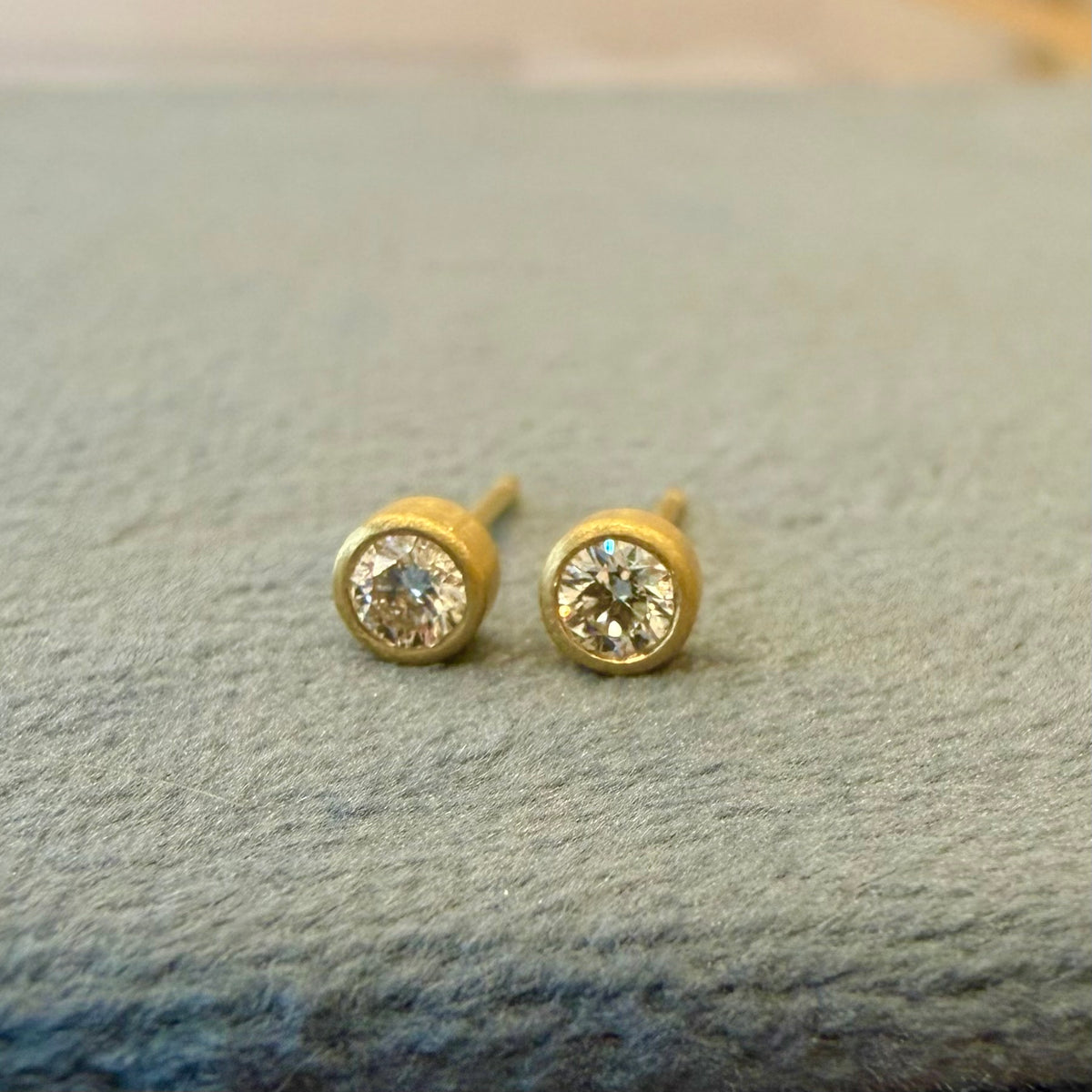 teeny studs - 10 pt diamonds