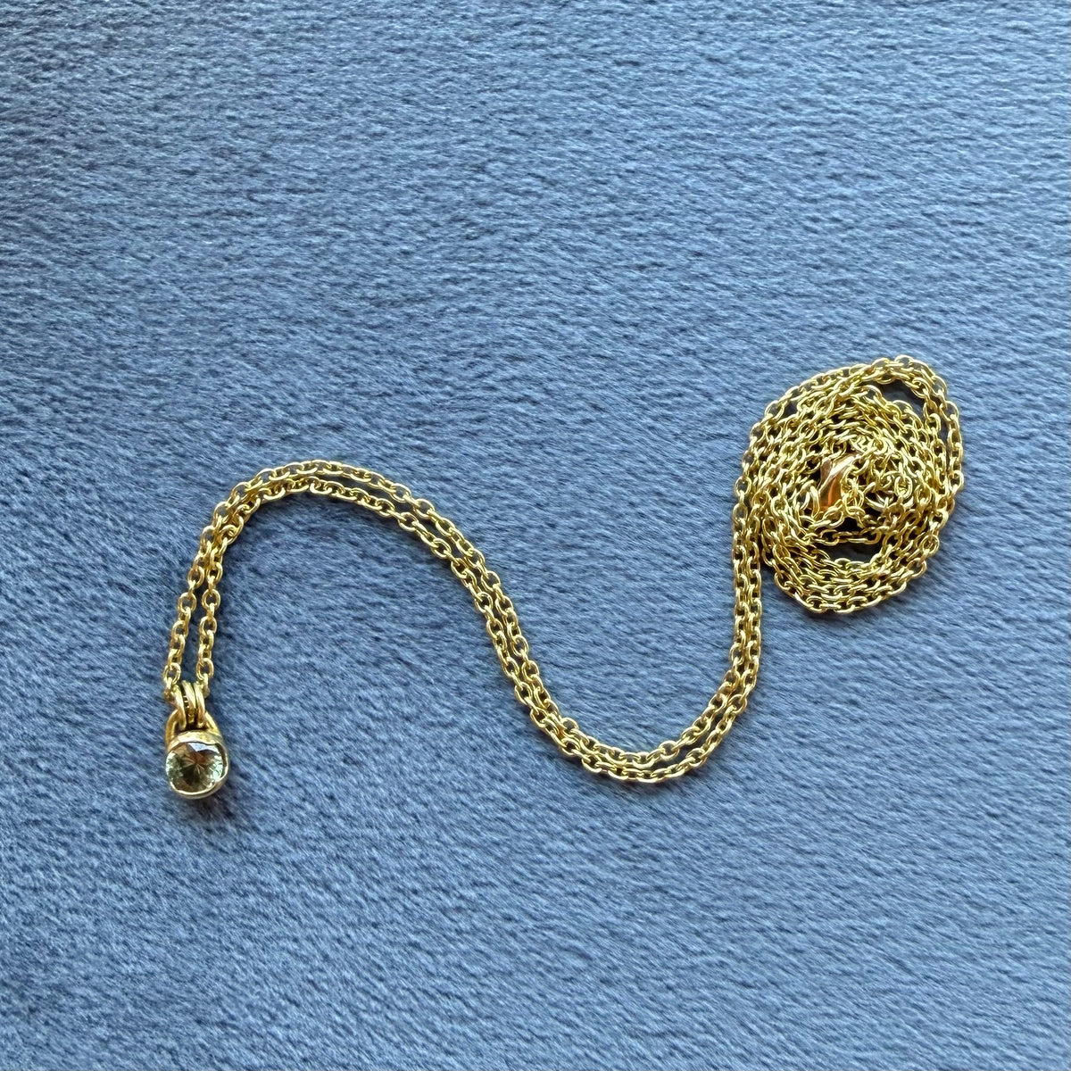 poppy bezel necklace with Montana blue sapphire