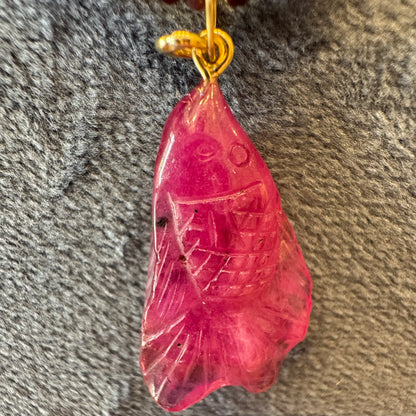 carved tourmaline fish charm